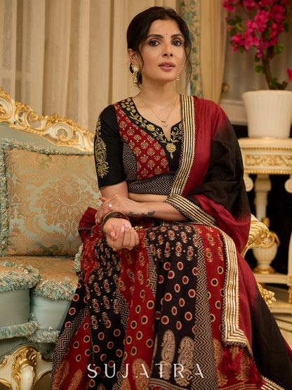 Handcrafted maroon & black Ajrakh print lehenga paired with an embroidered blouse for rich artisanal look - Dupatta Optional