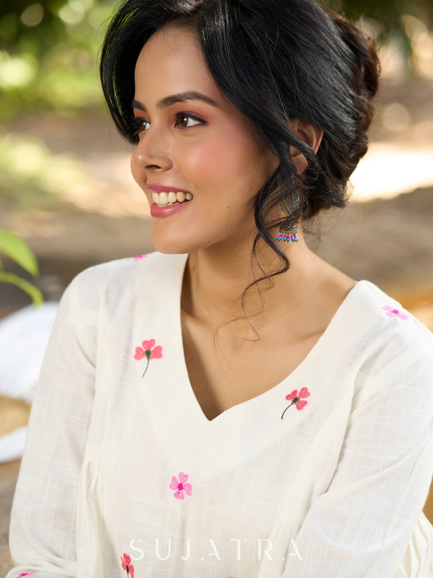 Blissful White Cotton Top with Intricate Hand Embroidery, V Neckline & Side Gathers