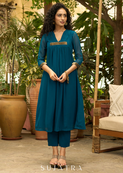Exclusive turquoise georgette front pleated Co ord set with gold sequence work