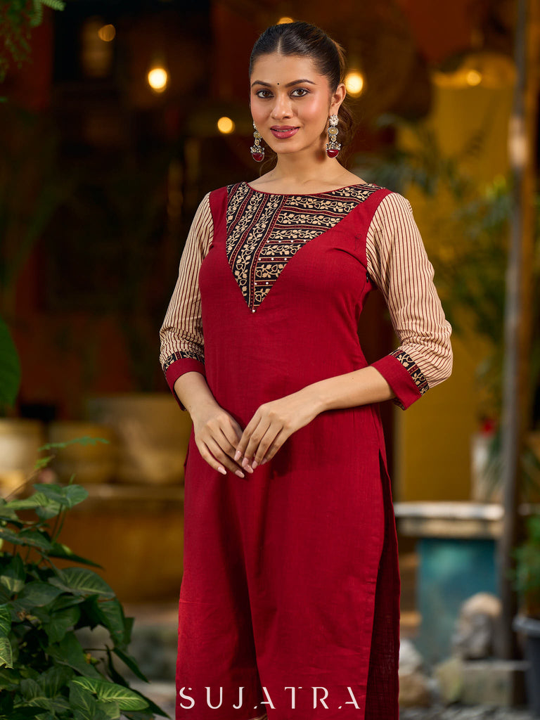 Handcrafted maroon kurta with a V-neck Ajrakh panel and stylish striped sleeves.
