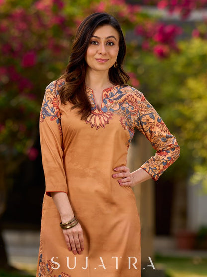 Elegant mustard kurta featuring Kalamkari print in an asymmetrical layout