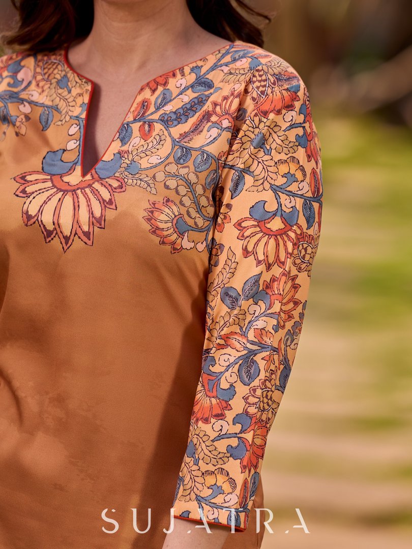 Elegant mustard kurta featuring Kalamkari print in an asymmetrical layout