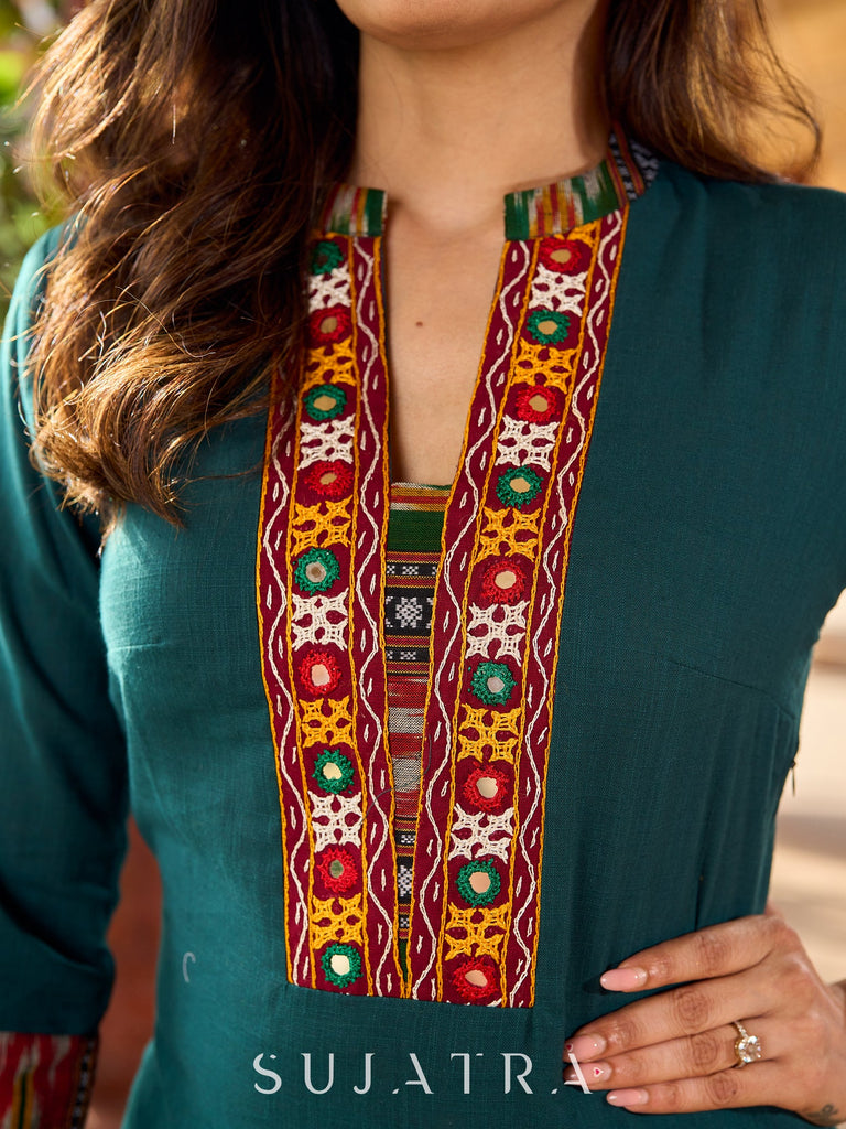 Dark green cotton kurta adorned with traditional Kutch mirror work-ikkat pant optional.