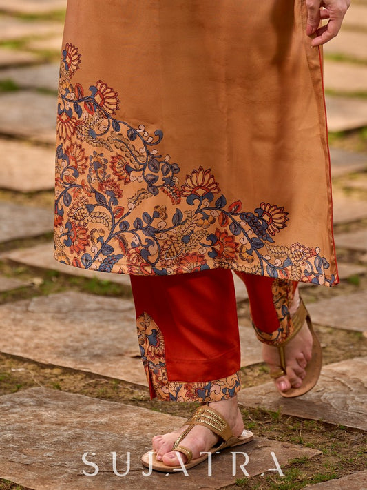 Soft, flowy orange rayon pants with a slit finished with elegant border detailing