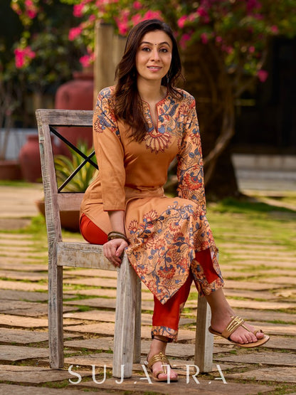 Elegant mustard kurta featuring Kalamkari print in an asymmetrical layout