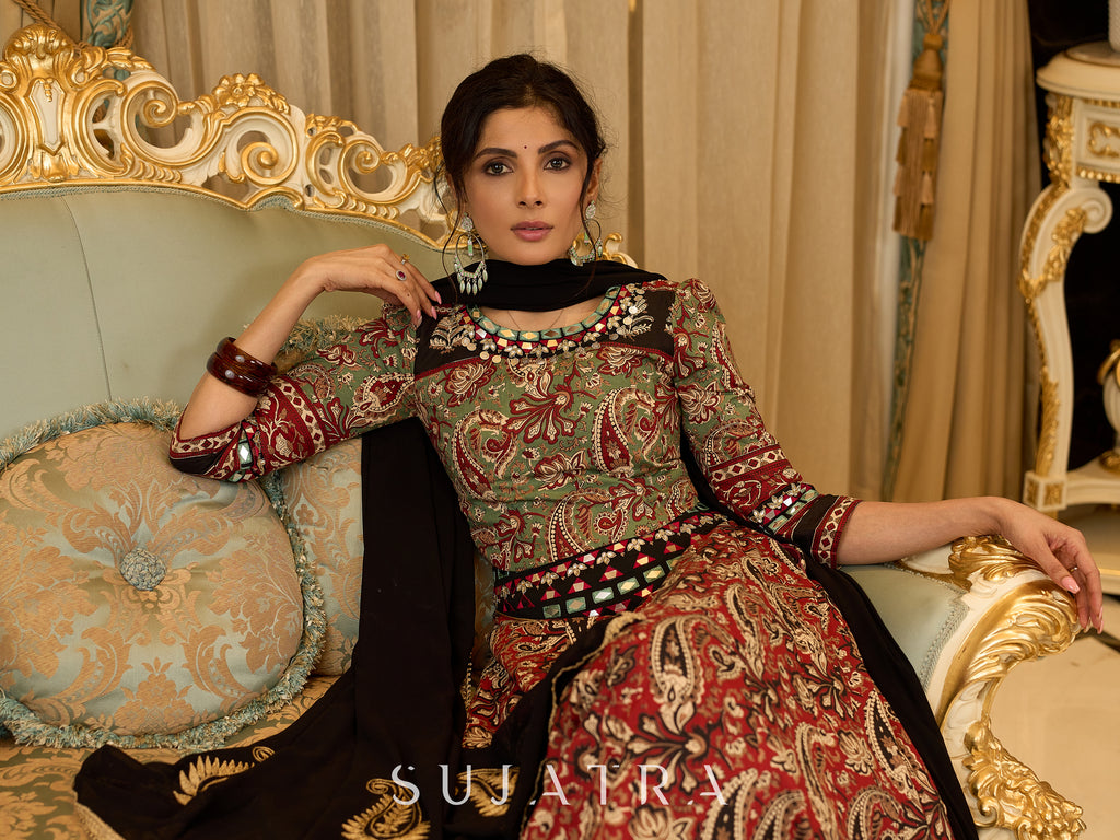 Contemporary folkloric ensemble featuring a petal cut block printed lehenga with mirror work accents  - Embroidered Dupatta Optional