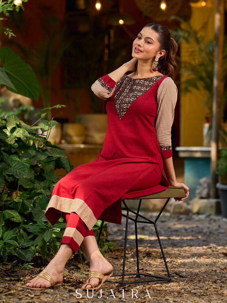 Handcrafted maroon kurta with a V-neck Ajrakh panel and stylish striped sleeves.