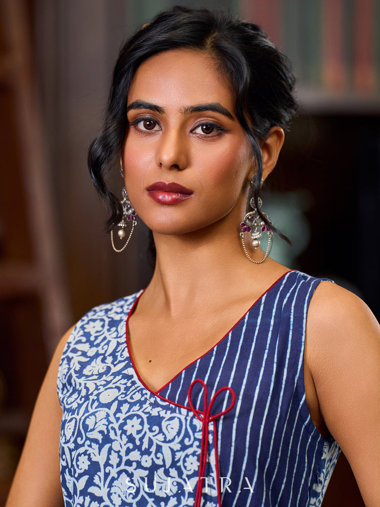 Graceful Indigo Floral Dress With Striped Panel Detailing And Contrasting Maroon Highlights