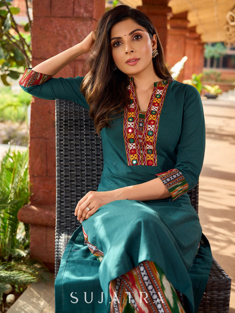 Dark green cotton kurta adorned with traditional Kutch mirror work-ikkat pant optional.