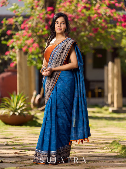 Elegant Blue Saree with Geometric Kalamkari Border and Contrasting Orange Accents