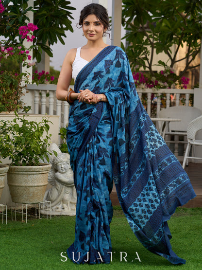 Hand block printed cotton saree in blue symphony and striking motifs