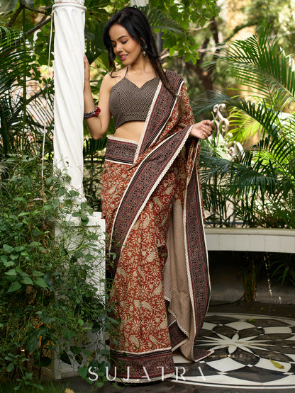 Earthy block-printed cotton saree with paisley charm and rustic elegance