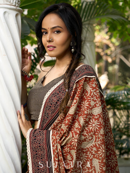 Earthy block-printed cotton saree with paisley charm and rustic elegance