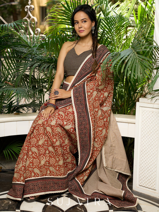 Earthy block-printed cotton saree with paisley charm and rustic elegance