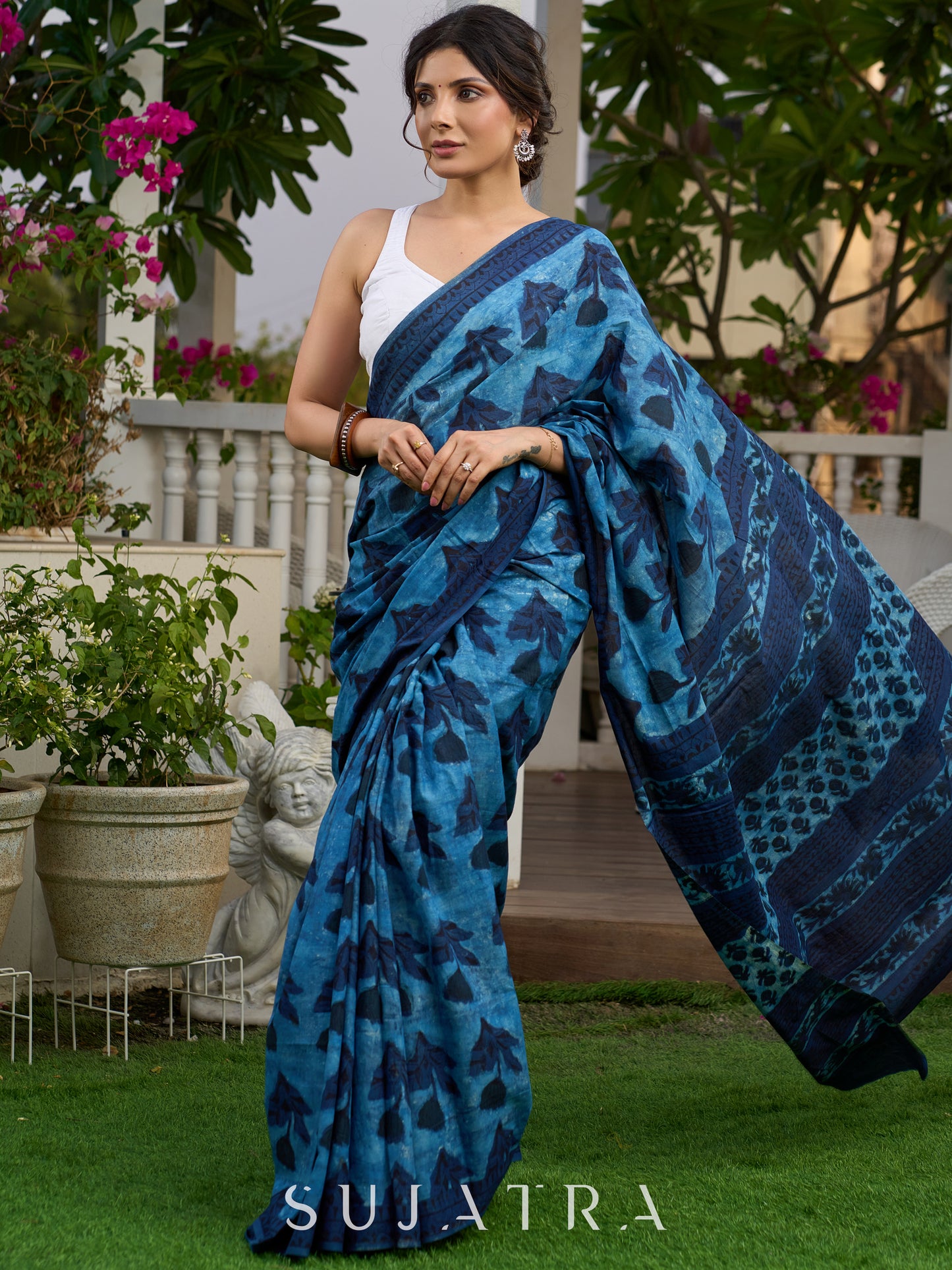 Hand block printed cotton saree in blue symphony and striking motifs