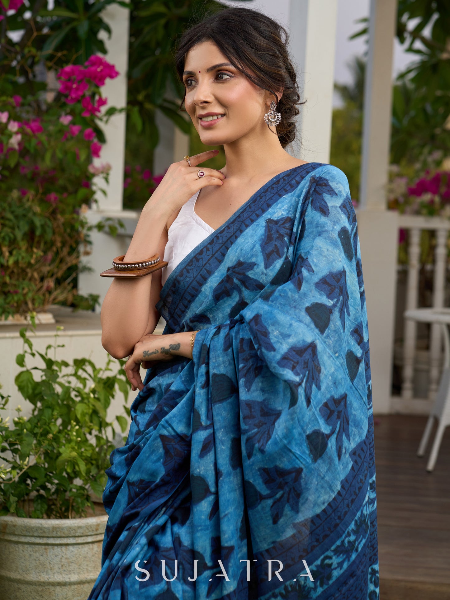Hand block printed cotton saree in blue symphony and striking motifs