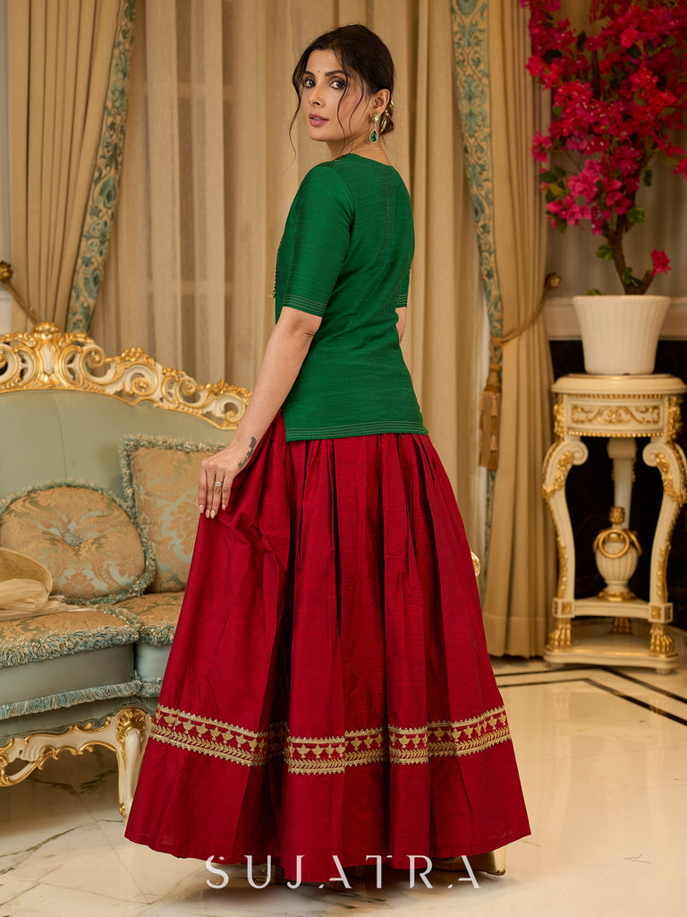 A traditional look featuring a red Cotton silk lehenga with a green Cotton silk choli with brocade yoke  - Contrast dupatta optional