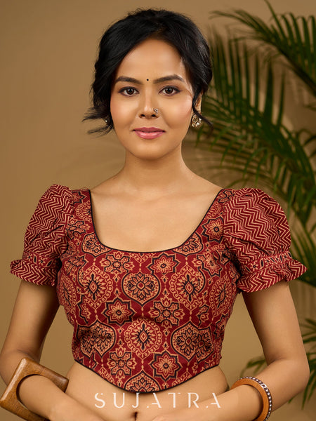 Sleek corset -style ajrakh fitted silhouette cotton blouse .