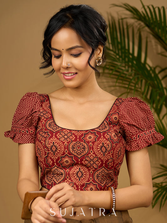 Sleek corset -style ajrakh fitted silhouette cotton blouse .