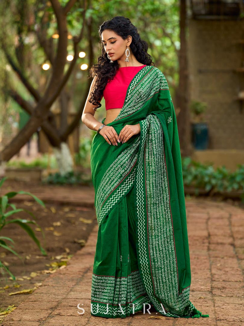 Refined Green Cotton Saree with Hand Block Printed Slogan Border & Contrasting Pink Accents