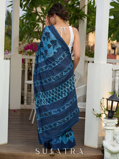 Hand block printed cotton saree in blue symphony and striking motifs