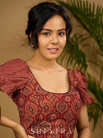 Sleek corset -style ajrakh fitted silhouette cotton blouse .