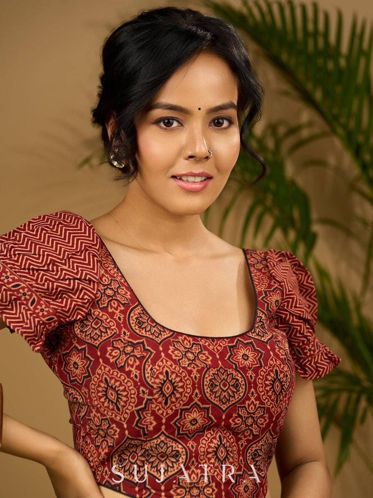 Sleek corset -style ajrakh fitted silhouette cotton blouse .