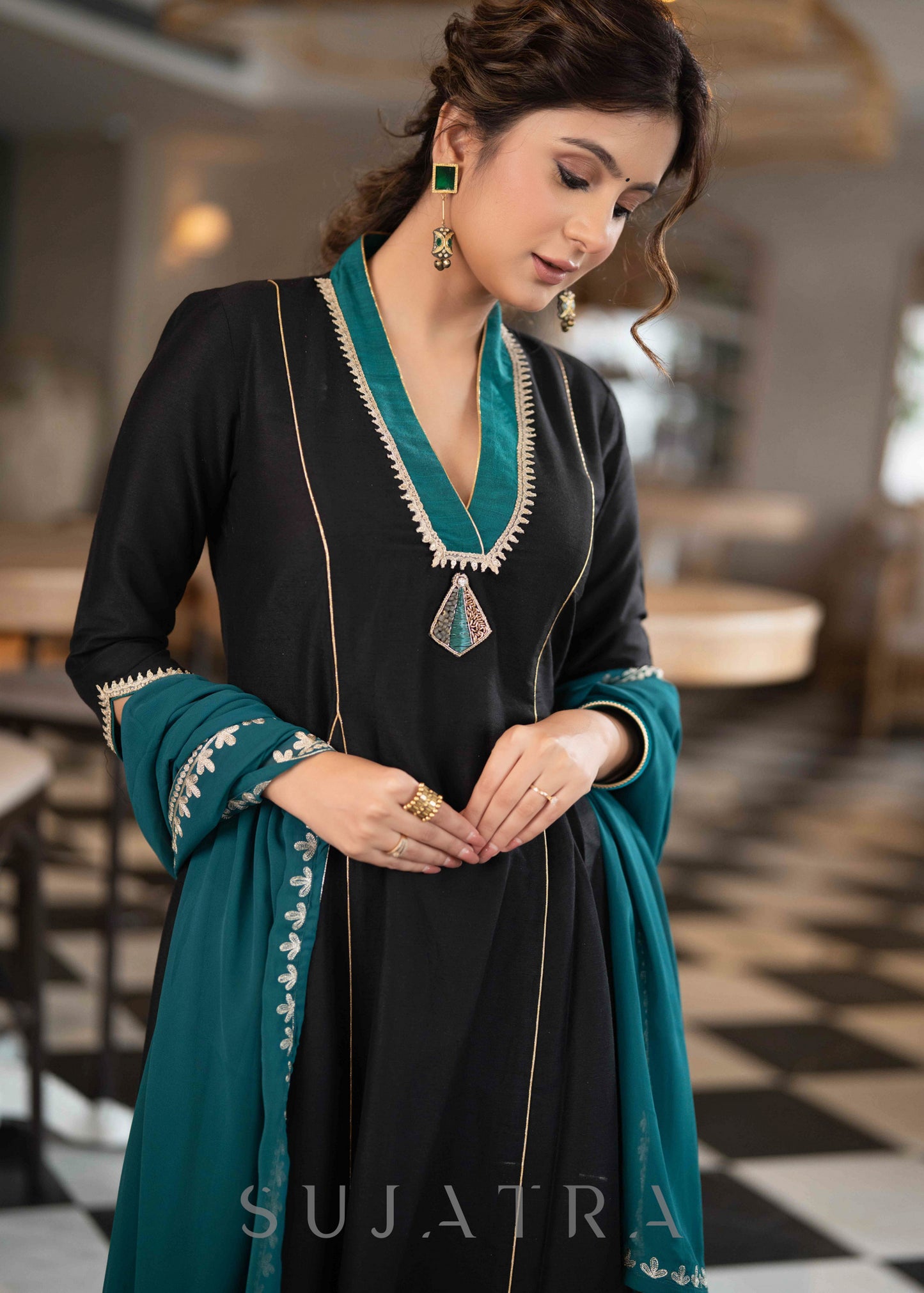 Beautiful A Line Kurta With Turquoise Detailing highlighted with Brooch