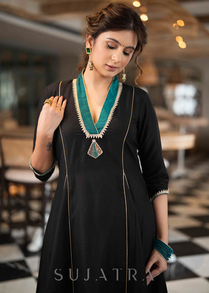 Beautiful A Line Kurta With Turquoise Detailing highlighted with Brooch