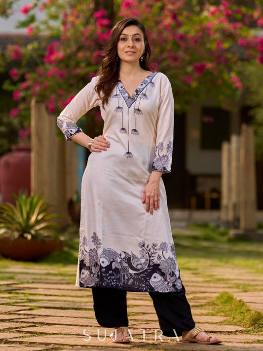 Artisanal cream kurta showcasing Madhubani fish and peacock motifs enhanced with bold black accents
