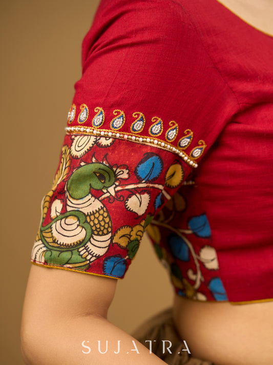 Elegant hand embroidered cotton blouse with intricate kalamkari border design.
