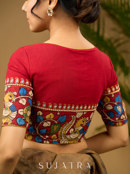 Elegant hand embroidered cotton blouse with intricate kalamkari border design.