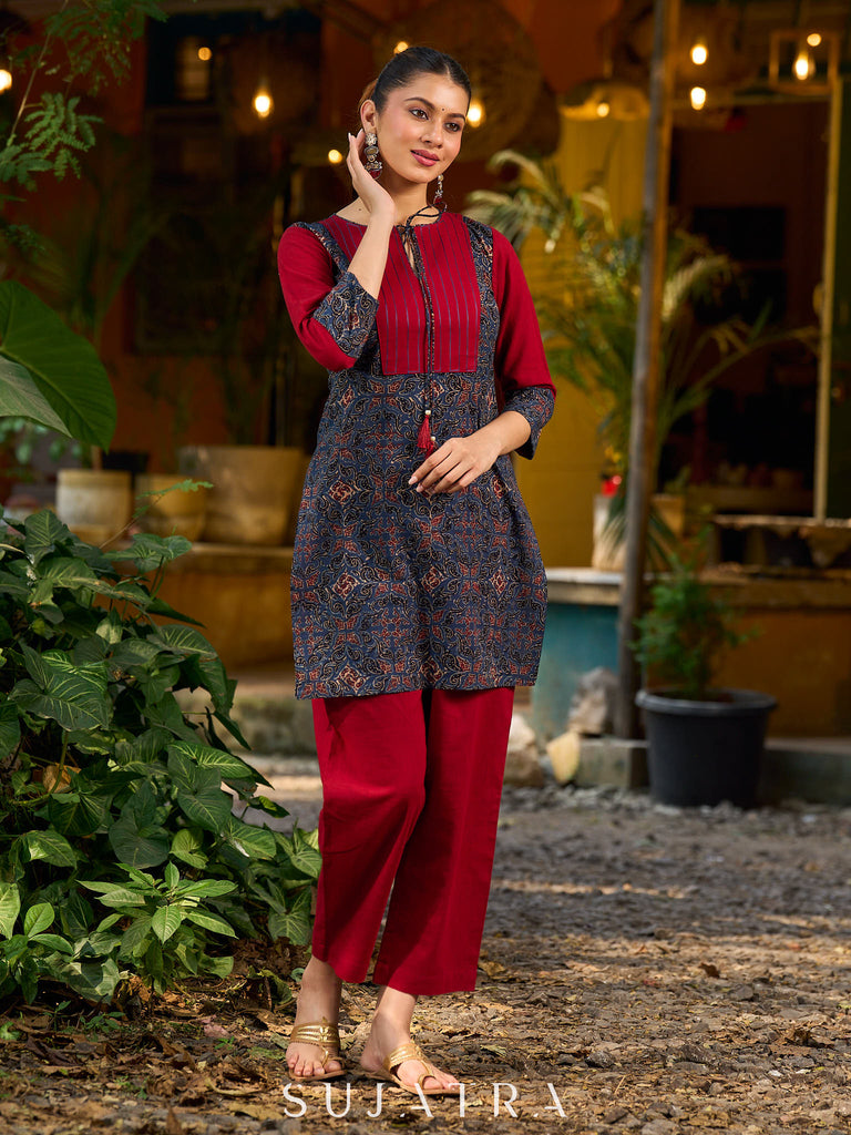 Blue Ajrakh short kurta with a handcrafted maroon patch.