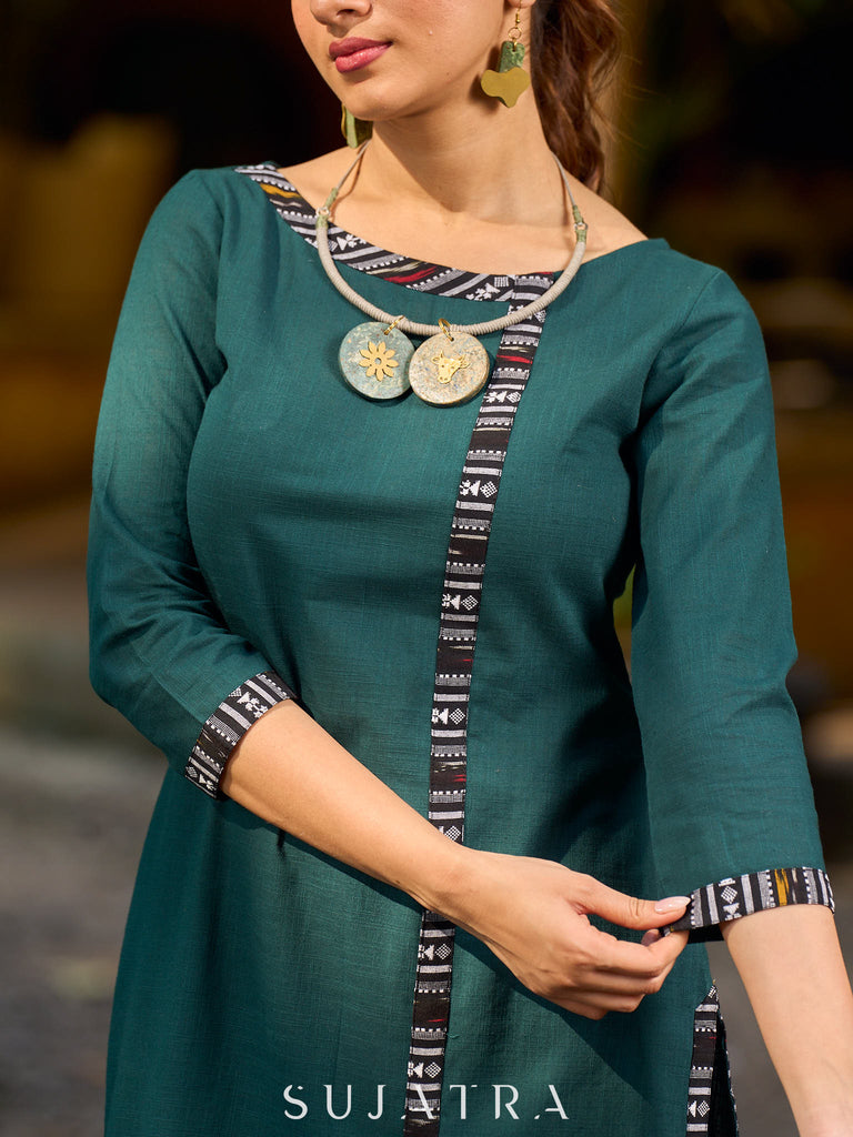 bottle green solid kurta with a refined ajrakh edging.