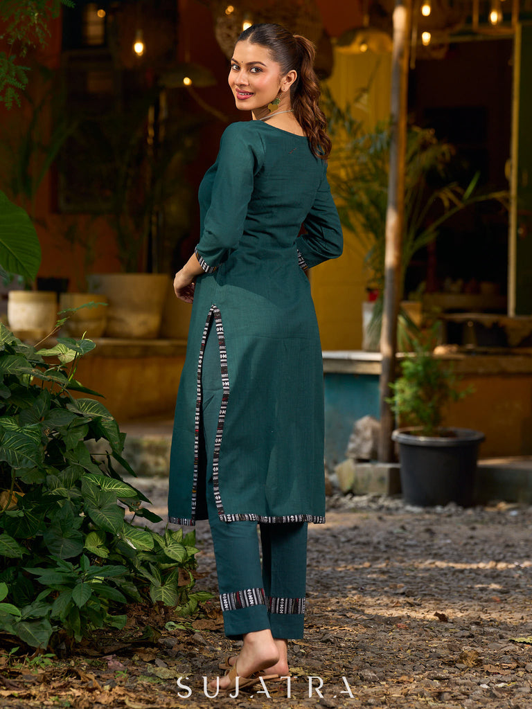bottle green solid kurta with a refined ajrakh edging.