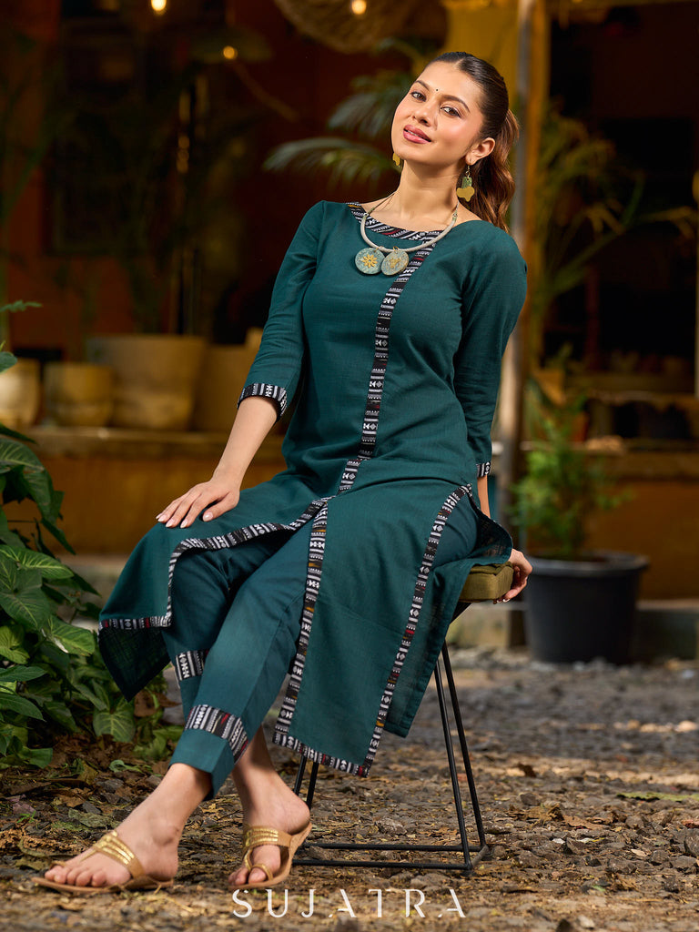 bottle green solid kurta with a refined ajrakh edging.