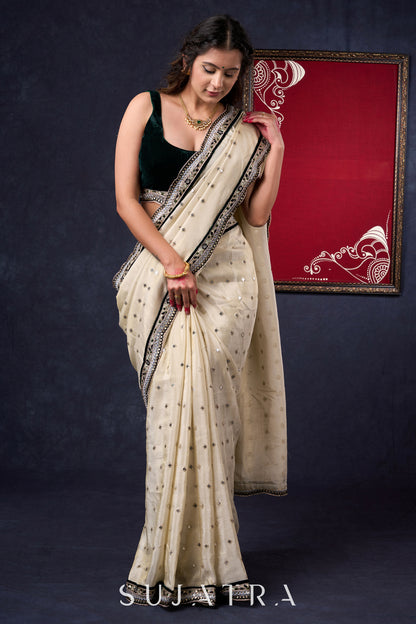 Classy Tissue saree with all-over work Highlighted with Beautiful border