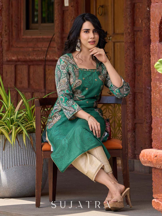 Statement green paisley kurta with detailed hand embroidery beautifully enhancing the print.