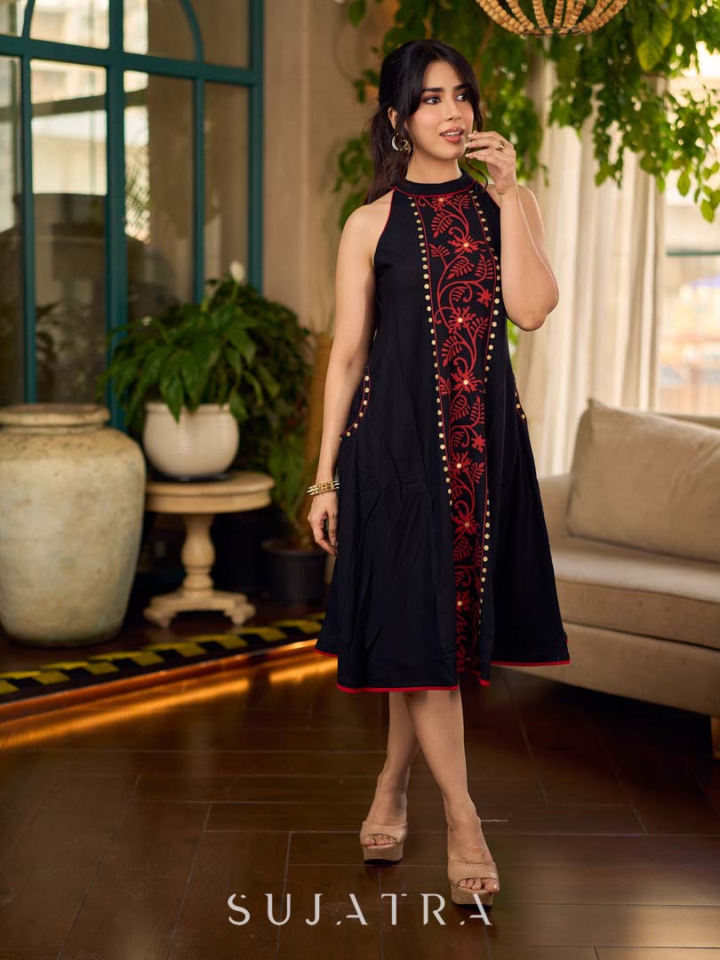 Black bias-cut block print halter dress with a red jaal hand block printed front panel, golden print detailing, and red accents for a striking, elegant statement look.