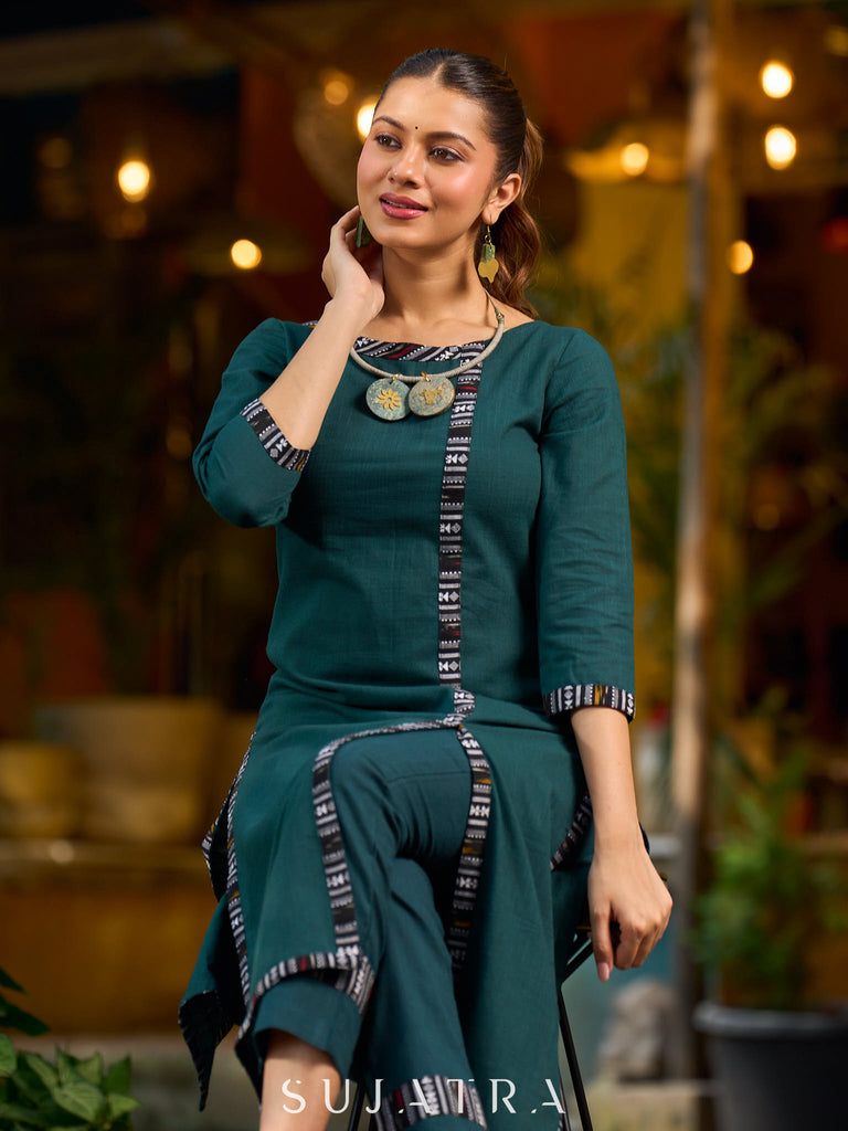 bottle green solid kurta with a refined ajrakh edging.