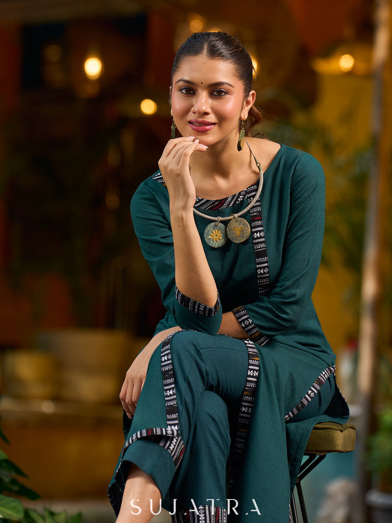 bottle green solid kurta with a refined ajrakh edging.