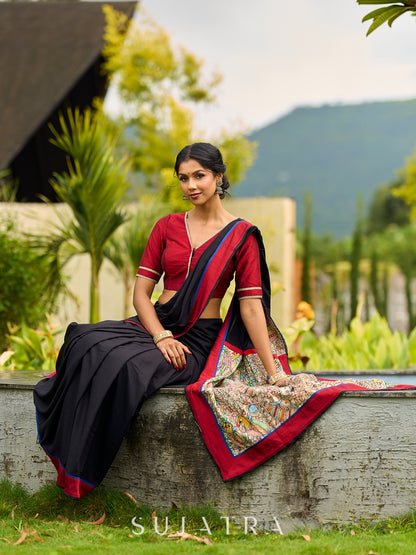 Striking Black Modal Saree with Hand-Painted Madhubani Pallu & Maroon-Blue Border