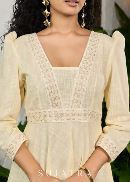Subtle light yellow cotton dress highlighted with beautiful embroidered lace