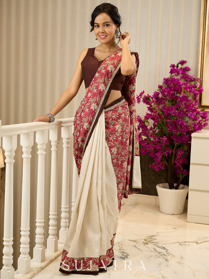 Ivory elegance meets rich pink florals in this exclusive cotton saree