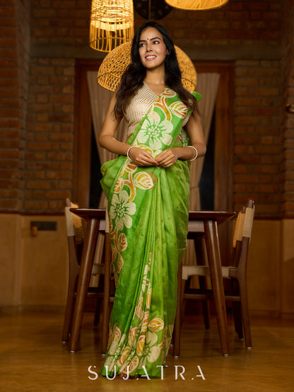 Handcrafted pure silk beauty in green with vibrant hand batik floral motif