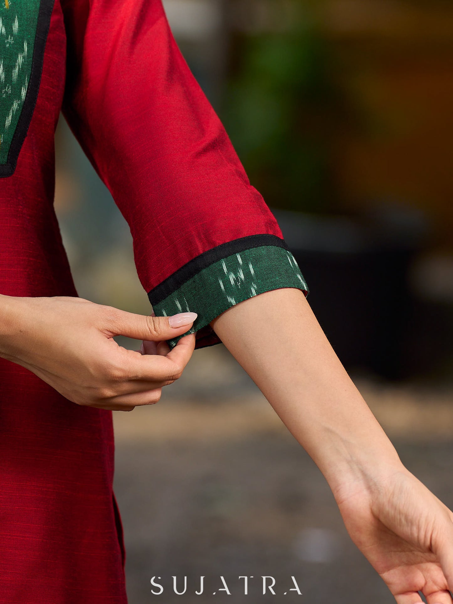 Elegant maroon cotton-silk kurta featuring a green Ikat patch and stand collar.