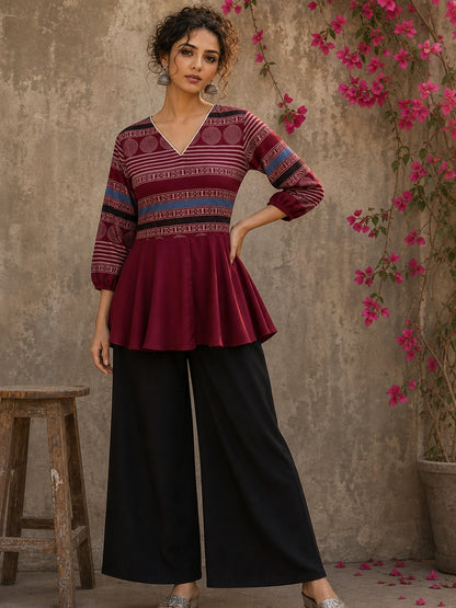 Bold and playful maroon hand block print peplum top with beige geometric motifs and subtle blue accents for effortlessly chic everyday style.