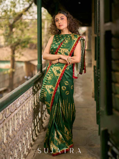 Bottle Green Shibori Art Silk Saree with Contrasting Red Bandhani Border
