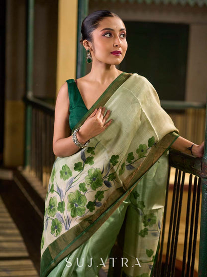 Muted Green Tussar Silk Saree with Delicate Floral Artwork and Classic Border