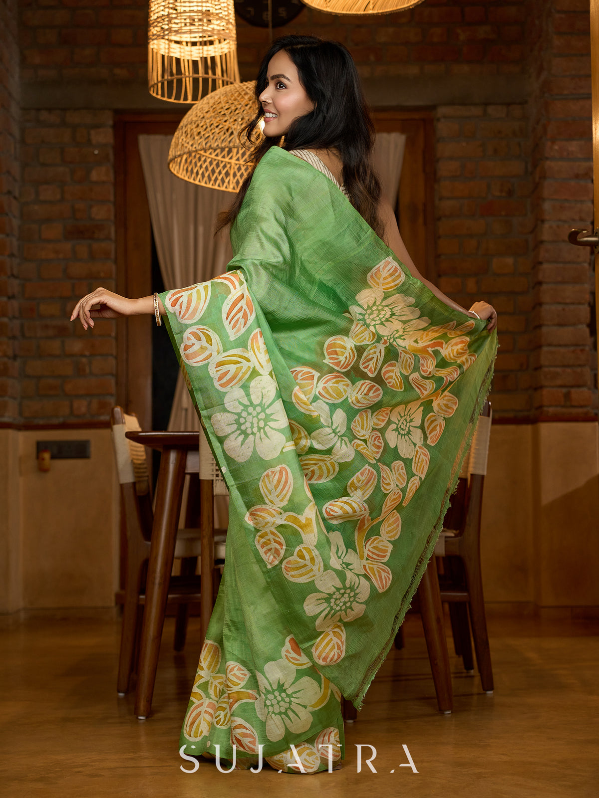 Handcrafted pure silk beauty in green with vibrant hand batik floral motif